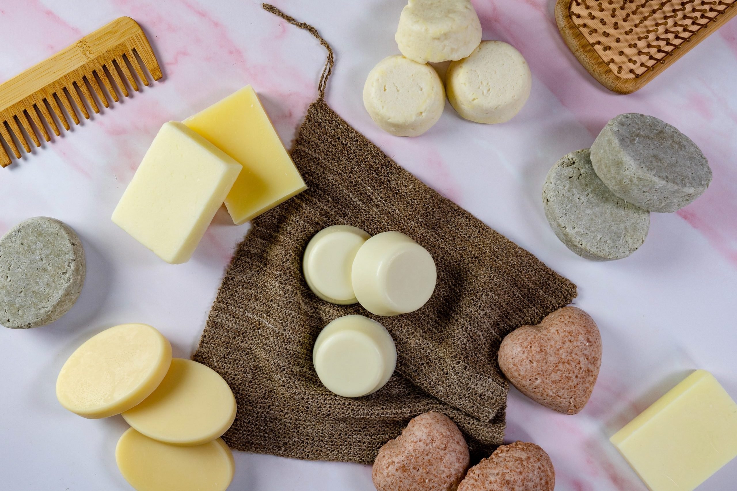 Solida shampoo and conditioner bars Assorted solid shampoo bars with comb on display.