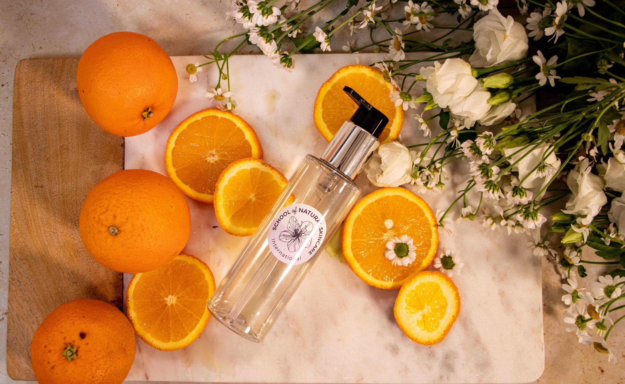 orange and neroli-05 Oranges and flowers with a skincare bottle
